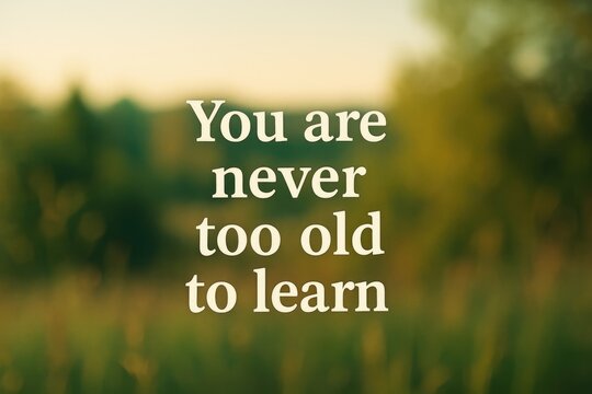 Motivational quote about lifelong learning displayed against a gentle nature scene