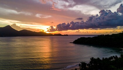 Fototapeta premium Tropical sunset over calm bay