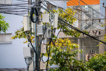 Urban Utility Pole with Power Lines and Boxes