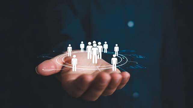 Hand holding a glowing network of diverse people figures representing community connection and global collaboration