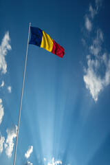 Waving National flag of Chad on flagpole in sky
