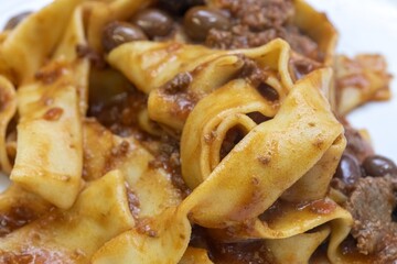 Traditional Italian pasta dish with perfectly cooked noodles and vibrant sauce in restaurant