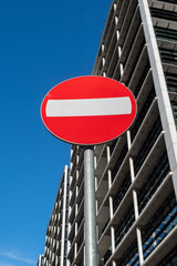 No entry traffic sign in front of modern building