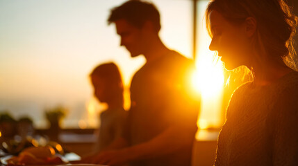 Silhouettes of a joyful family enjoying a sunny evening together