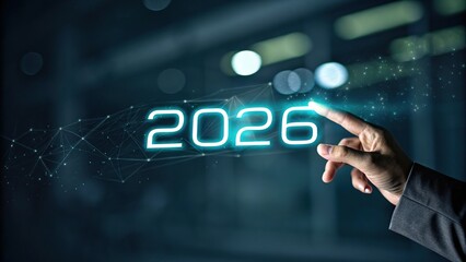 Human finger touches glowing neon digital display showing the year 2026
