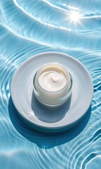 Luxurious skincare cream in glass jar on white plate floating on rippling blue water surface