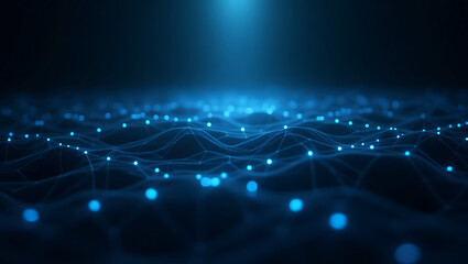Obraz premium Abstract glowing blue lights on a dark undulating surface with a bright light beam from above