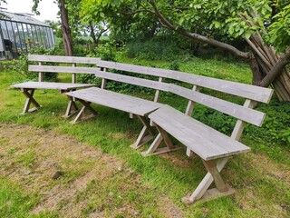 Rustic weathered wooden seating furniture in garden