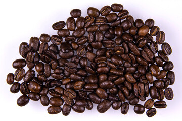 pile of roasted coffee beans isolated on white