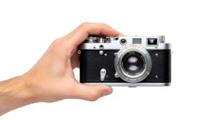 Hand Holding a Classic Black and Silver Vintage Camera CloseUp View.