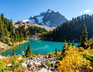 Picturesque alpine lake with snow-capped mountain and colorful foliage during autumn