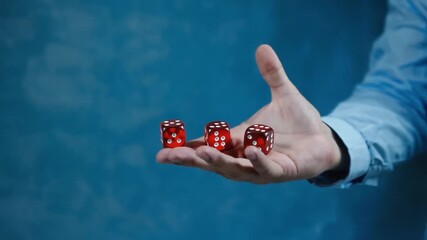 Hand throwing the dice. - Powered by Adobe