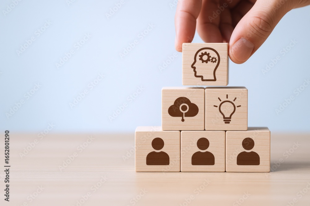 Poster building blocks of teamwork: hand stacking wooden cubes with iconography for collaboration and innov
