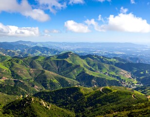 Fototapeta premium Rolling Green Hills of California Landscape under a Bright Blue Sky with Clouds
