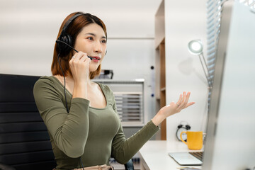 Serious call center operator in wireless headset talking to customer, woman in headphones with...