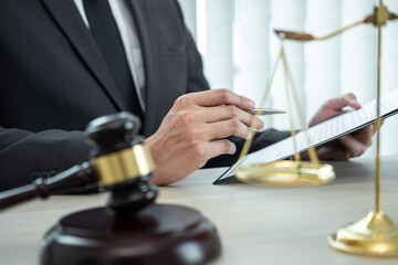 Male lawyer working with legal case document contract in office, law and justice, attorney, lawsuit...