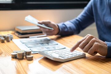 Young man and pile coins to planning growing saving strategy with pile coins for future plan fund of travel, education, home and retirement