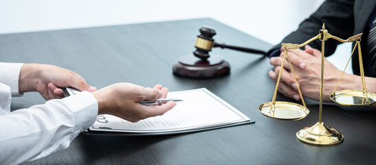 Professional Male lawyer or counselor discussing negotiation legal case with client meeting with...