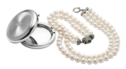 Cosmetic compact next to pearl necklace, isolated on white background