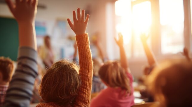 Students raising hands in classroom