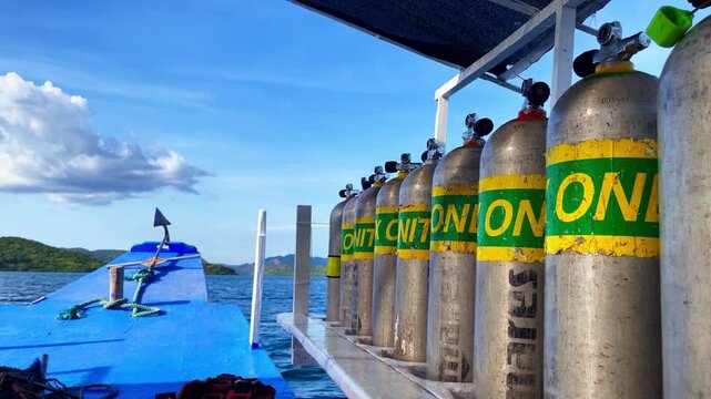 scubadiving air cylinders on bangka boat with Nitrox prints