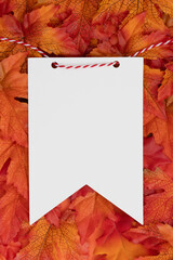 Blank pennant paper tag with fall leaves for autumn season themes