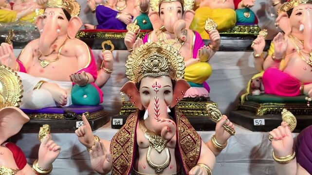 Newly made idols of the God known as Ganesha or Ganapati for sale at a shop on the eve of Ganesh festival in Pune, India.