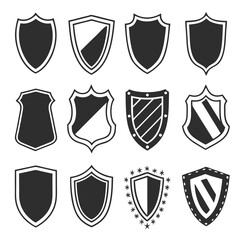 Collection of twelve diverse black shield icons with varied designs and outlines on a white background