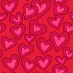 Vector illustration, seamless pattern of hand drawn scattered hearts in shades of pink and red
