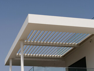 a pergola, an outdoor architectural structure typically consisting of vertical posts or columns...