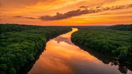 Stunning sunset over river with golden reflections and vibrant forest landscape