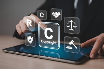 Naklejka premium Protecting Intellectual Property Rights with Digital Copyright Law Trademark and Patents on a Touchscreen Tablet for Legal Protection and Business Strategy