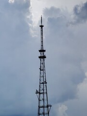 Obraz premium cell phone tower. big cloud sky tv tower metal construction object antenna television landscape