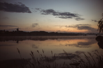 sunrise over the foggy river in Toruń © Przemylsaw Budzynski