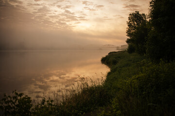 sunrise over the foggy river in Toruń © Przemylsaw Budzynski