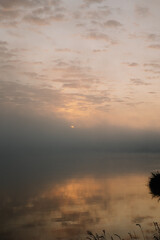 Fototapeta premium sunrise over the foggy river in Toruń