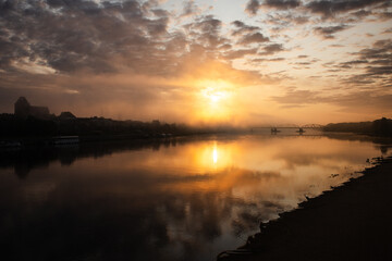 sunrise over the foggy river in Toruń © Przemylsaw Budzynski