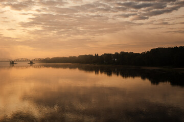 sunrise over the foggy river in Toruń