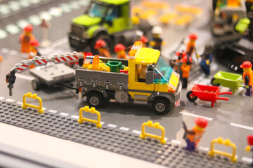 Obraz premium Colorful lego construction scene with truck and workers