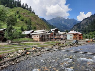 The breathtaking beauty of Taobat Bala, located in the Neelum Valley of Kashmir. This location boasts a stunning valley filled with lush green trees, towering mountains, and sparkling flowing springs. © KHAWAJA UMER FAROOQ