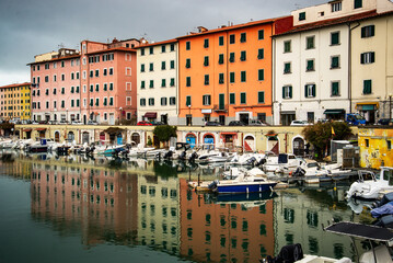 A canal so called "fossi with moored boats in the Venezia Nuova, Livorno, Italy