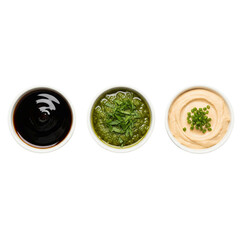 Three delicious dips arranged in a row on a white background