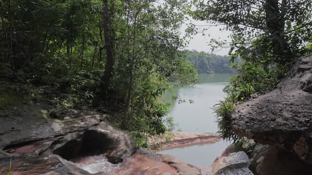 Stunning 4K footage of Pha Phueng Waterfall in Phu Phayak National Park, Sakon Nakhon, Thailand. Serene tropical nature, flowing water, and lush forest scenery.