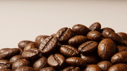 Close-up photo of roasted coffee beans with rich textures, natural oil sheen, and deep brown tones. Perfect for coffee packaging, branding, and cafe-related design projects.