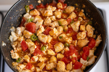 sauteed chicken with tomatoes	close up