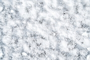 Obraz premium Close up texture of fresh snow and ice crystals on the ground in winter
