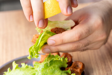 Making raw meatballs ( Turkish: Cig Kofte ) on wooden background	