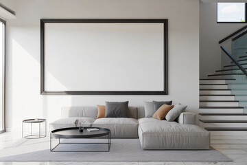 Modern minimalist living room with large blank canvas, sectional sofa, and modern staircase.