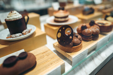 desserts on display in cafe showcasing gourmet variety and sweet indulgence, pastries arranged in...