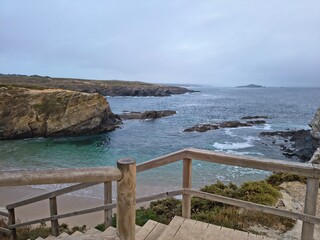 Stairs descending down a cliff over the Atlantic ocean in Porto Covo